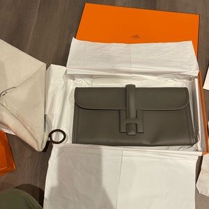 Hermès Jige leather clutch bag